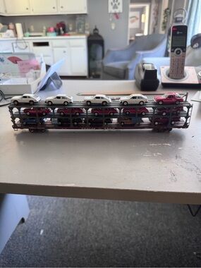 Die-Cast Car Carrier Train Car with White and Red Cars